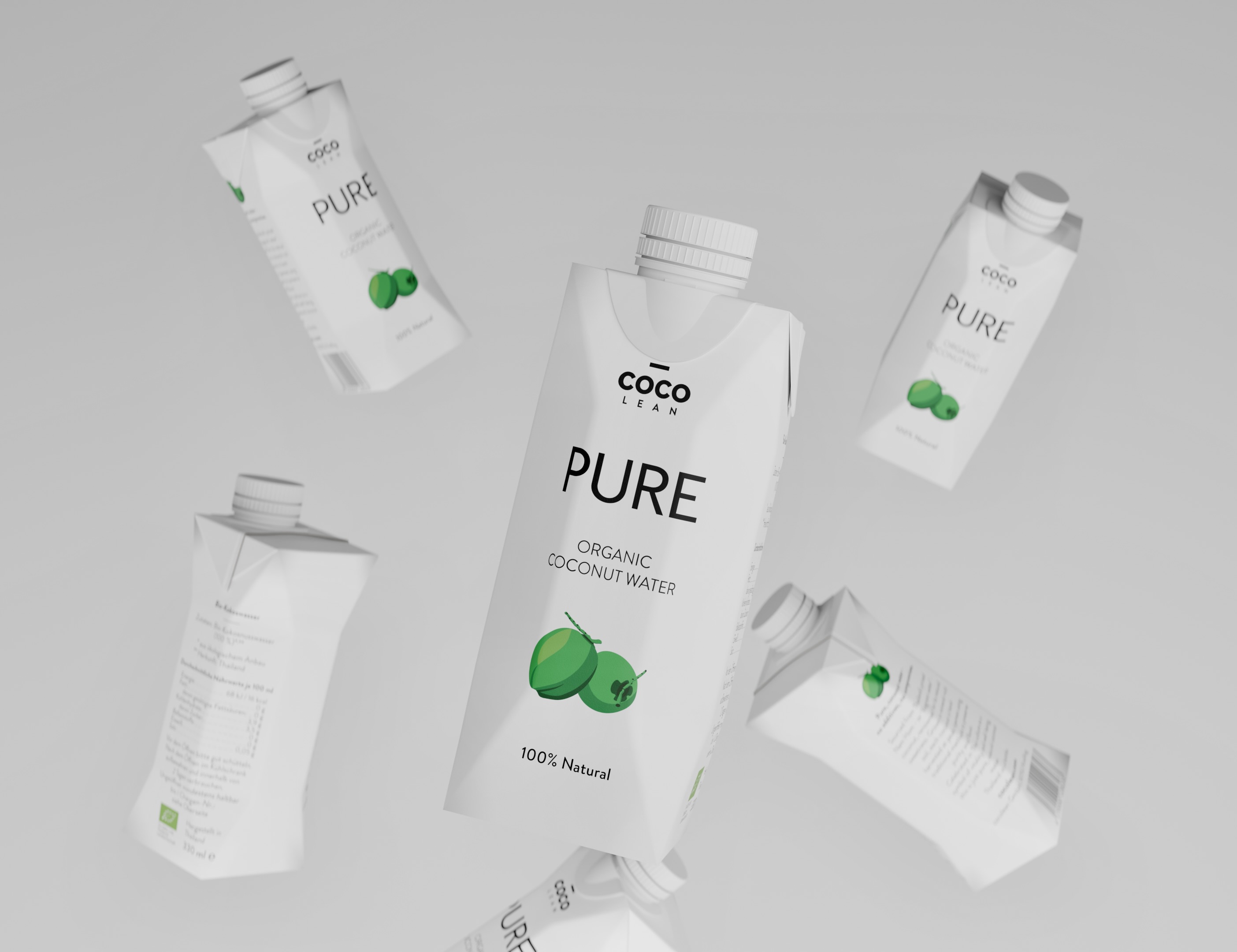 Single Nam Hom coconut with the top removed — soft natural light, water visible at the opening